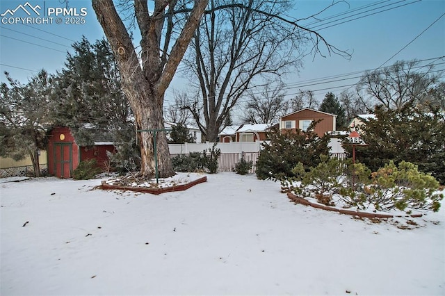 view of yard layered in snow