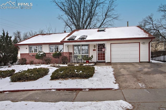 single story home featuring a garage