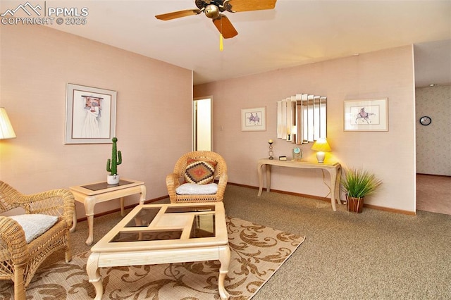 sitting room with ceiling fan and carpet flooring