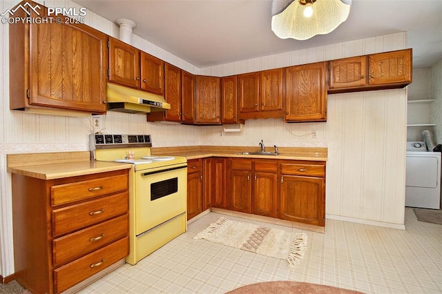 kitchen with washer / clothes dryer, sink, and range with electric stovetop