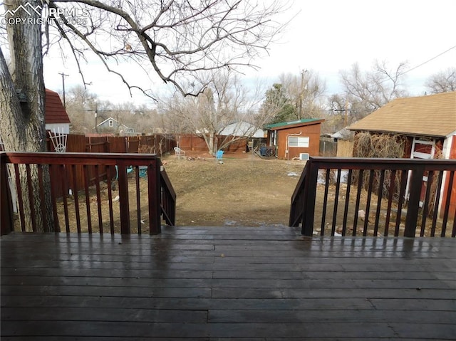 wooden deck with a storage unit