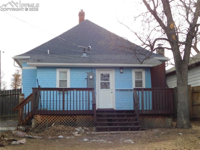 back of house with a wooden deck