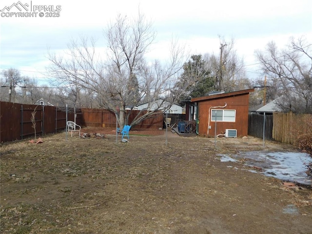 view of yard featuring central air condition unit