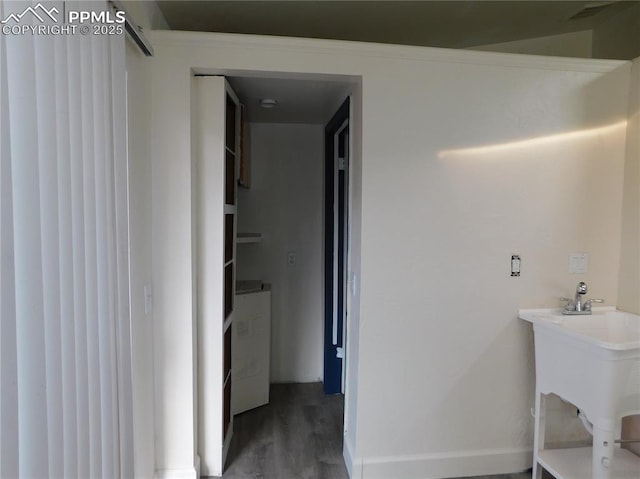 bathroom with hardwood / wood-style flooring and sink