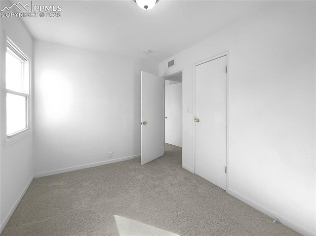 unfurnished bedroom with carpet