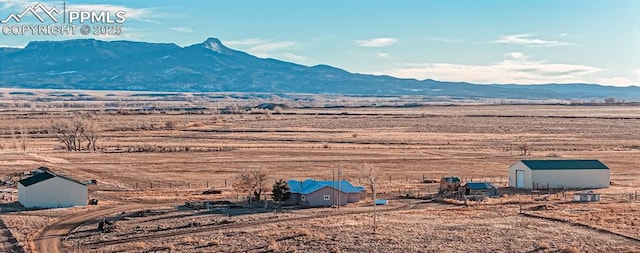 view of mountain feature with a rural view