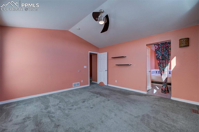 unfurnished bedroom with carpet floors, ceiling fan, and vaulted ceiling