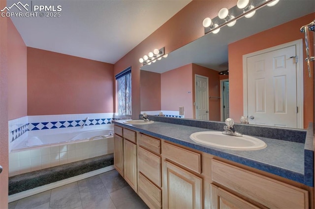 bathroom with tile patterned floors, tiled bath, and vanity