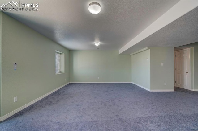 empty room featuring carpet floors and a textured ceiling