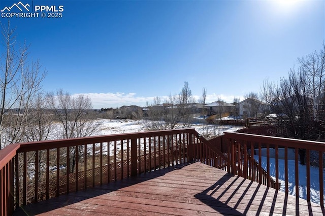 view of snow covered deck