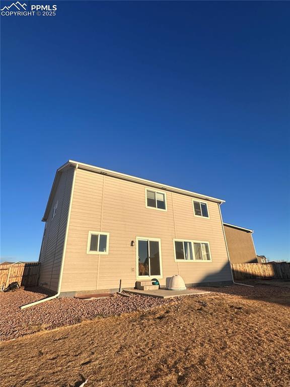 rear view of property featuring a patio area