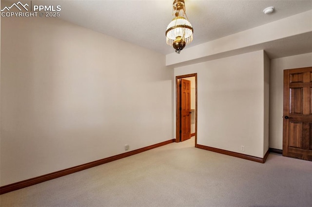 spare room with light colored carpet