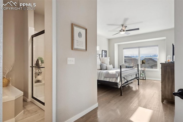 bedroom with ceiling fan and light hardwood / wood-style flooring