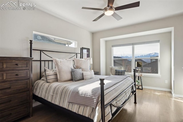 bedroom with hardwood / wood-style flooring and ceiling fan