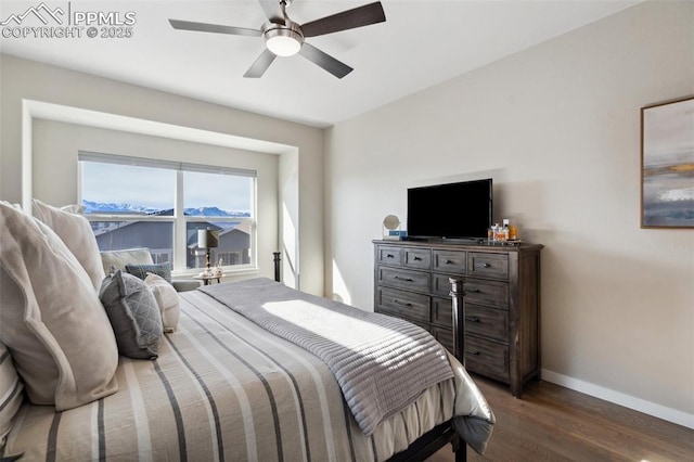 bedroom featuring dark hardwood / wood-style flooring and ceiling fan