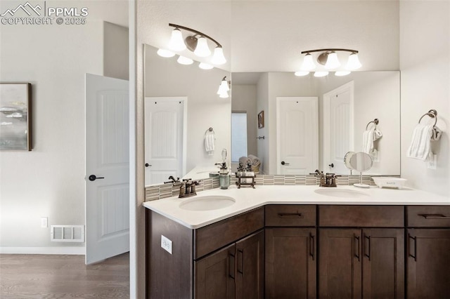 bathroom featuring vanity and wood-type flooring