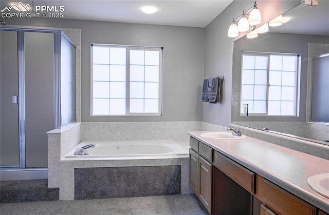 bathroom featuring vanity and shower with separate bathtub