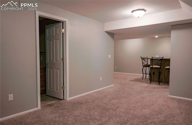 basement with light colored carpet