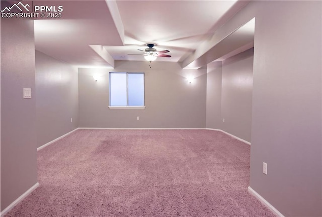 empty room featuring ceiling fan and carpet