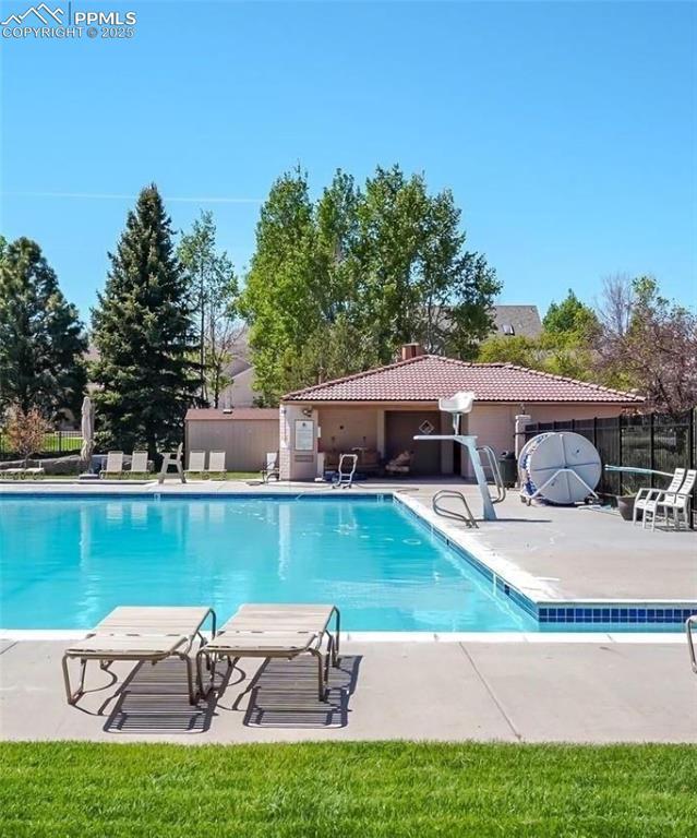 view of swimming pool featuring a patio area