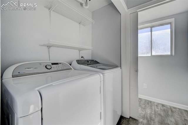 washroom featuring washer and clothes dryer and hardwood / wood-style floors