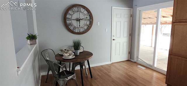 interior space with a wealth of natural light and light hardwood / wood-style floors