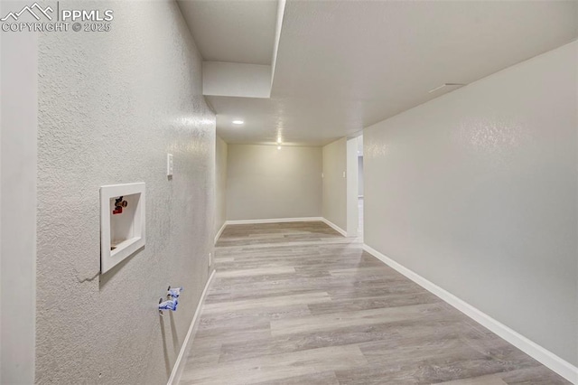 washroom with light hardwood / wood-style floors