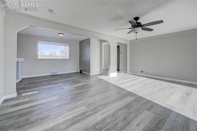 unfurnished living room featuring hardwood / wood-style floors and ceiling fan