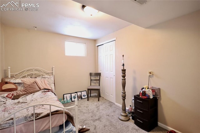 carpeted bedroom featuring a closet