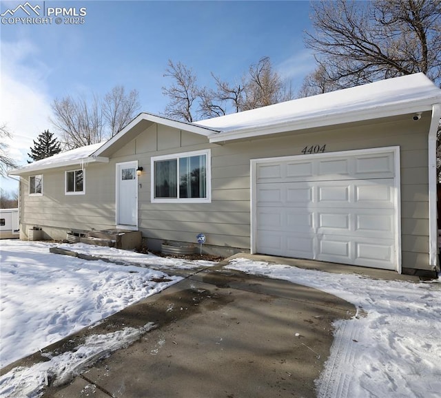 ranch-style house featuring a garage