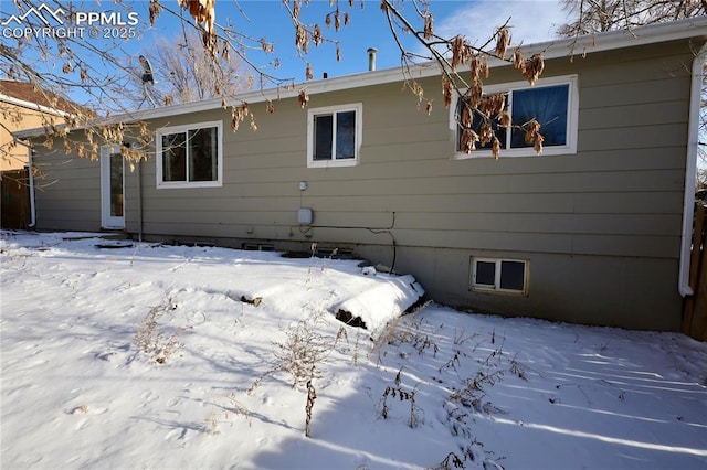 view of snow covered property