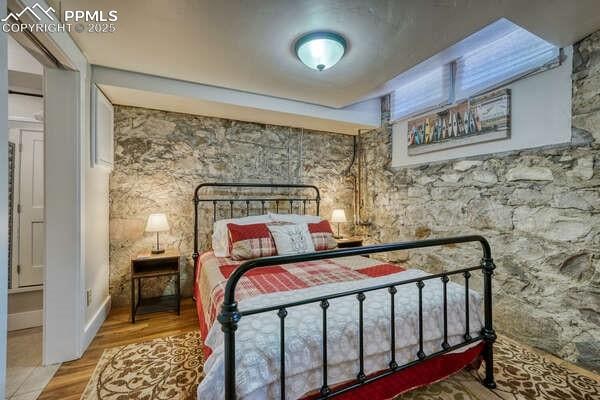 bedroom featuring wood-type flooring