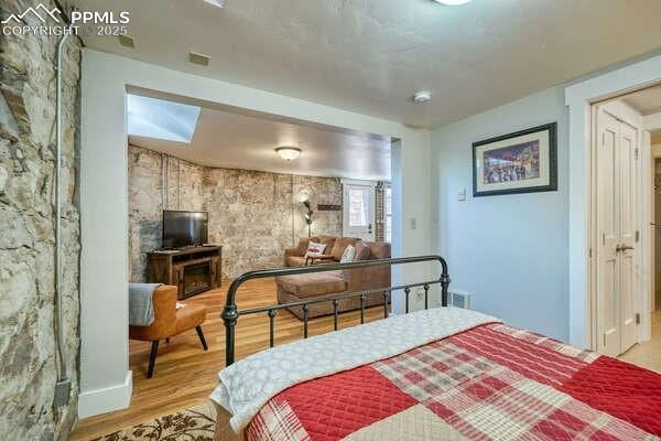 bedroom featuring light hardwood / wood-style floors