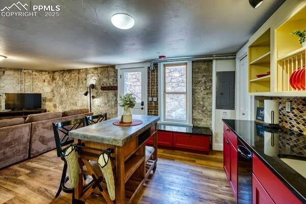 kitchen featuring dark wood-type flooring and electric panel