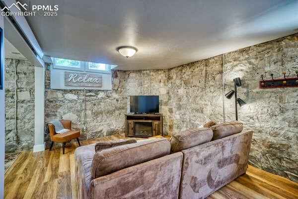 living room with hardwood / wood-style flooring and a fireplace