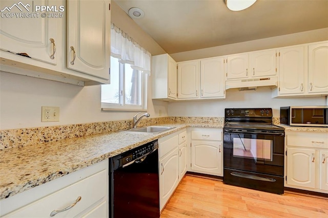 kitchen featuring sink, white cabinets, and black appliances