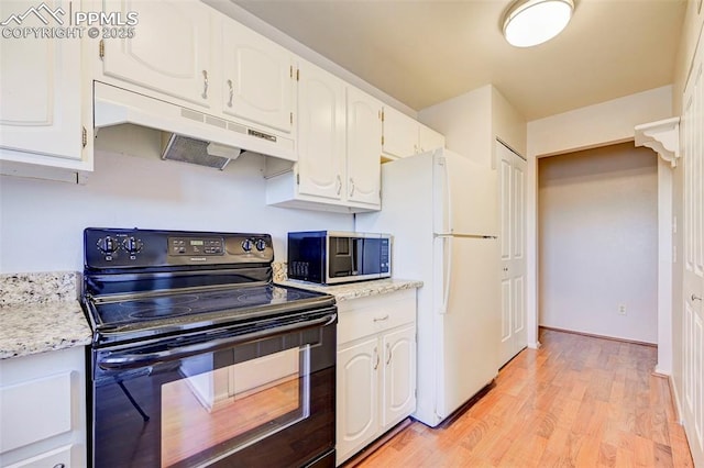 kitchen featuring white cabinetry, black range with electric cooktop, white refrigerator, and light wood-type flooring