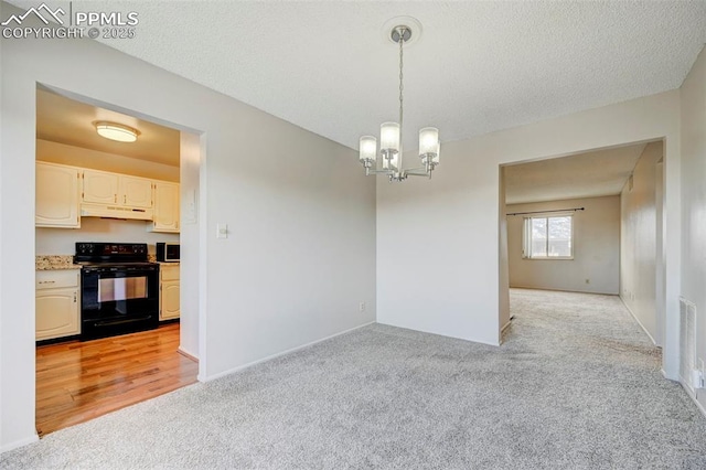 interior space with light carpet, a textured ceiling, and a chandelier