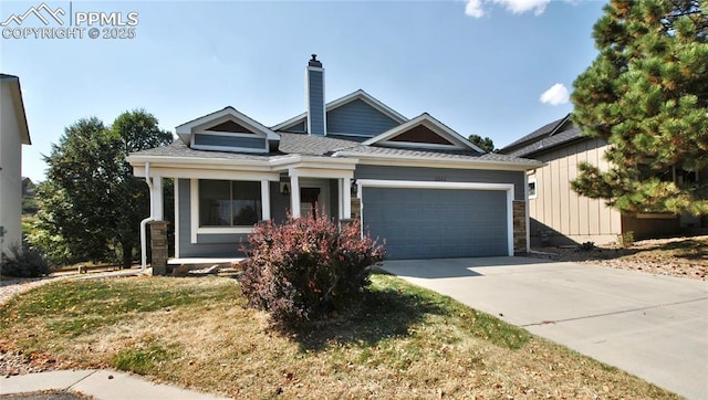 view of front of house with a front yard and a garage