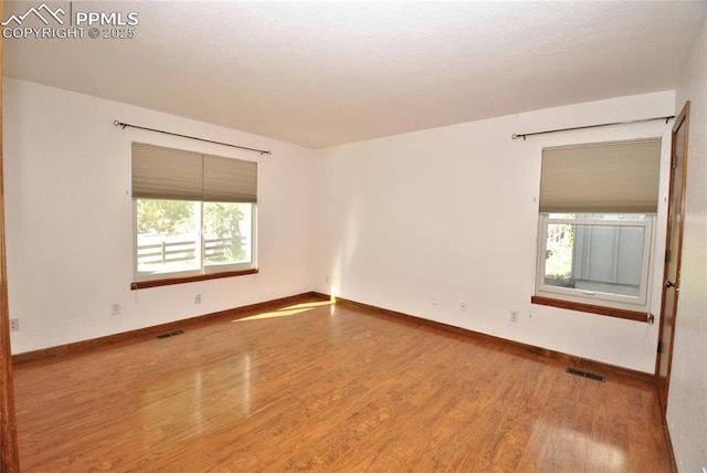 empty room featuring hardwood / wood-style floors