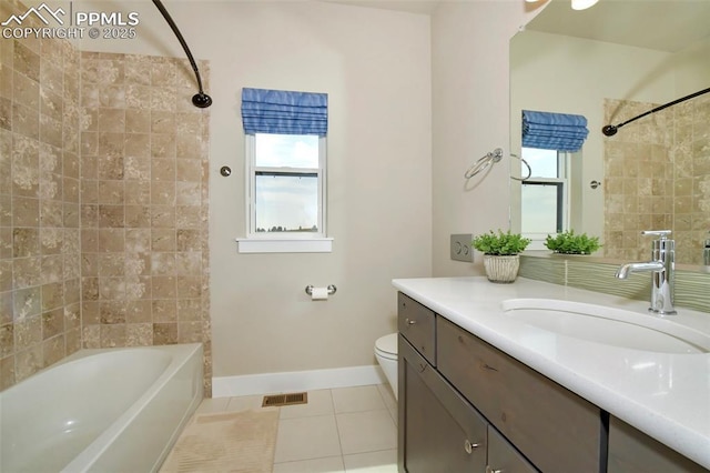 full bathroom with toilet, vanity, tiled shower / bath combo, and tile patterned floors