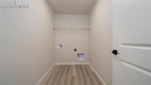 clothes washing area featuring hookup for a washing machine, laundry area, baseboards, light wood-type flooring, and electric dryer hookup