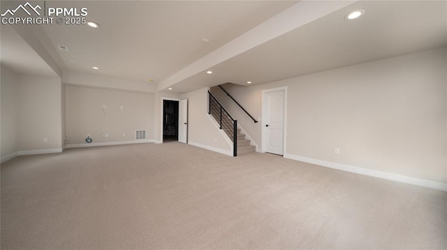 basement featuring recessed lighting, light carpet, visible vents, baseboards, and stairs