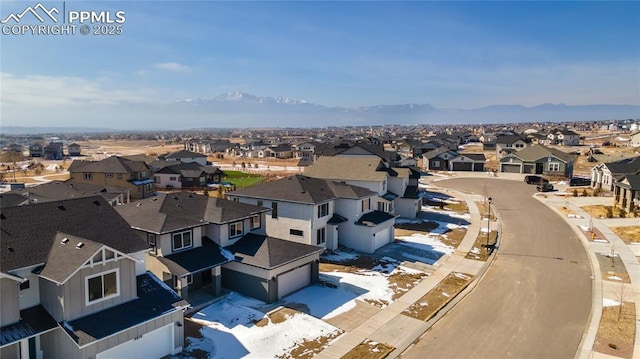 drone / aerial view with a mountain view and a residential view