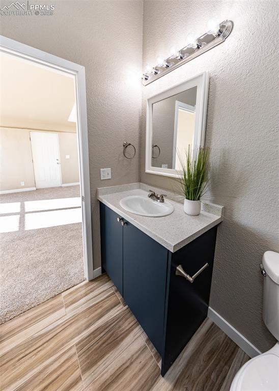 bathroom with vanity and toilet