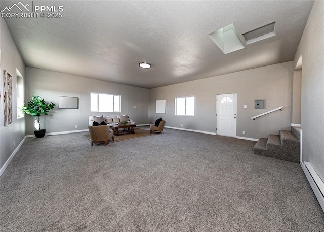 unfurnished living room featuring a textured ceiling, carpet floors, and a baseboard radiator