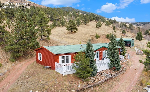 birds eye view of property with a mountain view