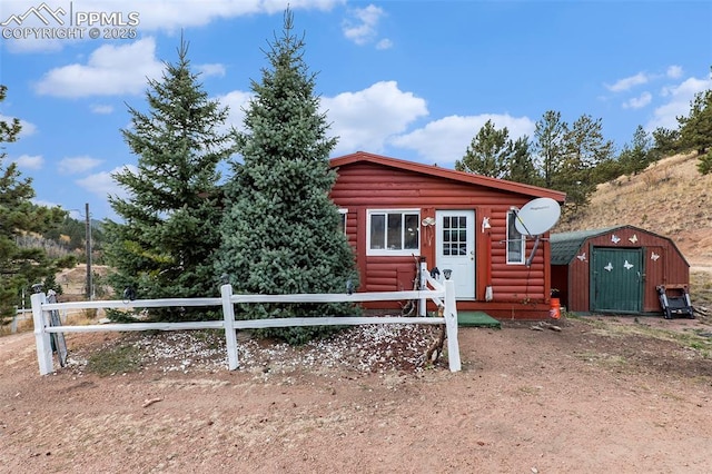 exterior space with a storage shed