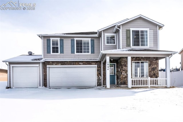 view of front of property with a garage and a porch