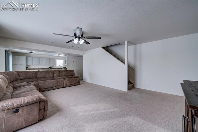 living room featuring light carpet and ceiling fan